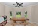 Dining area with natural light, ceiling fan, and views of the spacious backyard at 16758 Ne 135Th Ave, Fort Mc Coy, FL 32134