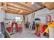 Spacious garage interior showing storage, bikes, and work space for various projects at 16758 Ne 135Th Ave, Fort Mc Coy, FL 32134