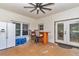 Covered patio with ceiling fan, refrigerator, bar, and French doors leading to the interior at 16758 Ne 135Th Ave, Fort Mc Coy, FL 32134