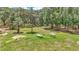 Exterior image of two hammocks sitting on a grassy lawn surrounded by mature trees at 16758 Ne 135Th Ave, Fort Mc Coy, FL 32134