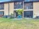 View of a backyard area and screened in patios of adjacent townhomes at 1806 Foxhall Cir # 1806, Kissimmee, FL 34741
