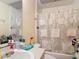 Functional bathroom with a shower/tub combo and ample storage space at 1806 Foxhall Cir # 1806, Kissimmee, FL 34741