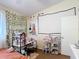 Bright bedroom with a blank projector screen at 1806 Foxhall Cir # 1806, Kissimmee, FL 34741