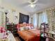 A personalized bedroom decorated with a unique and eclectic style with ceiling fan at 1806 Foxhall Cir # 1806, Kissimmee, FL 34741