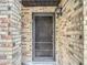 Close-up of the brick facade and front door at 1806 Foxhall Cir # 1806, Kissimmee, FL 34741