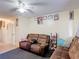 A comfortable living room featuring tile floors and a neutral color scheme at 1806 Foxhall Cir # 1806, Kissimmee, FL 34741