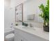 Bright bathroom features a shower-tub combo, white cabinets, and neutral decor for a clean, modern look at 2080 Ashwood Bluff Dr, Ocoee, FL 34761