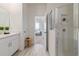 Bathroom featuring a modern vanity, a glass-enclosed shower, and neutral-toned flooring at 2080 Ashwood Bluff Dr, Ocoee, FL 34761