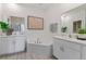 Elegant bathroom featuring double vanity sinks, modern fixtures, and a separate soaking tub at 2080 Ashwood Bluff Dr, Ocoee, FL 34761