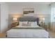 Cozy bedroom featuring a comfortable bed, side tables with lamps, and tasteful wall decor at 2080 Ashwood Bluff Dr, Ocoee, FL 34761