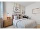 Stylish bedroom with sports theme, large window, plaid bedding, and dedicated desk space at 2080 Ashwood Bluff Dr, Ocoee, FL 34761