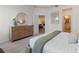 Open bedroom view reveals stylish decor and a glimpse into adjacent rooms, enhancing the home's appeal at 2080 Ashwood Bluff Dr, Ocoee, FL 34761