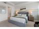 Spacious bedroom with a king-sized bed, stylish decor, and ample natural light creating a serene retreat at 2080 Ashwood Bluff Dr, Ocoee, FL 34761