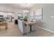 Bright dining room featuring modern decor, wood style flooring, and a stylish light fixture at 2080 Ashwood Bluff Dr, Ocoee, FL 34761