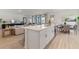 Spacious kitchen island with seating overlooking living room and dining room at 2080 Ashwood Bluff Dr, Ocoee, FL 34761