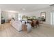 Spacious living room with modern furniture, light wood floors, and ample natural light at 2080 Ashwood Bluff Dr, Ocoee, FL 34761