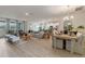 Open living space featuring connected living room, dining room, and modern kitchen at 2080 Ashwood Bluff Dr, Ocoee, FL 34761