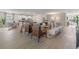 Open living space with kitchen, living, and dining areas; features modern decor and light wood floors at 2080 Ashwood Bluff Dr, Ocoee, FL 34761