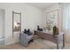Home office featuring a modern desk, comfortable seating, stylish artwork, and ample natural light at 2080 Ashwood Bluff Dr, Ocoee, FL 34761