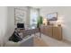 Comfortable home office with a modern desk, chair, stylish decor, and natural light from a window at 2080 Ashwood Bluff Dr, Ocoee, FL 34761