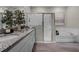 Bathroom featuring a double sink vanity, walk-in shower, and soaking tub at 2092 Ashwood Bluff Dr, Ocoee, FL 34761