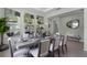 Dining room featuring a sleek wooden table and abstract art decorations at 2092 Ashwood Bluff Dr, Ocoee, FL 34761