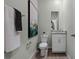 This well-lit bathroom features a toilet, vanity with granite countertop, and modern decor at 2117 Greenwood Oak Dr, Ocoee, FL 34761