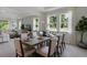 Dining area bathed in natural light, perfect for entertaining, next to living room at 2117 Greenwood Oak Dr, Ocoee, FL 34761