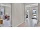 Bright foyer featuring wood-look floors, an office space to the left, and a welcoming entry door at 2117 Greenwood Oak Dr, Ocoee, FL 34761