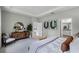 Bright main bedroom showcasing a decorative accent wall, soft carpet, and modern decor throughout the space at 2117 Greenwood Oak Dr, Ocoee, FL 34761
