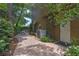 Lovely brick back patio with greenery surrounding the area and a small white table set at 2238 Hawick Ln # 2238, Winter Park, FL 32792