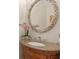 Elegant bathroom vanity featuring granite countertop, decorative mirror and faucet at 2238 Hawick Ln # 2238, Winter Park, FL 32792