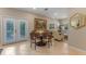 Charming dining area with French doors, a round table, and a seamless transition to the cozy living room for easy entertaining at 2238 Hawick Ln # 2238, Winter Park, FL 32792