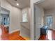 Bright hallway with wooden floors, neutral walls and doors leading to other rooms at 2238 Hawick Ln # 2238, Winter Park, FL 32792