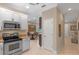 Bright kitchen featuring stainless steel appliances, granite countertops, and light-colored cabinetry at 2238 Hawick Ln # 2238, Winter Park, FL 32792