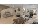 Open-concept living room with tile flooring, a comfortable seating area, and seamless flow to the kitchen and dining spaces at 2238 Hawick Ln # 2238, Winter Park, FL 32792