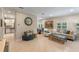 Bright living room with tile floors, a comfortable sofa, and views into the kitchen and dining areas, perfect for entertaining at 2238 Hawick Ln # 2238, Winter Park, FL 32792