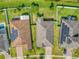 Aerial view of the roof and backyard, showing well-maintained lawn, fences, and driveways at 2426 Addison Creek Dr, Kissimmee, FL 34758