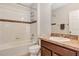 Bathroom featuring a tub with shower, toilet, and vanity at 2426 Addison Creek Dr, Kissimmee, FL 34758