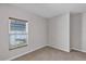 Bedroom view featuring a window, base molding, and neutral paint at 2426 Addison Creek Dr, Kissimmee, FL 34758