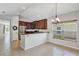 Eat-in kitchen with wooden cabinets, granite countertops, and stainless appliances at 2426 Addison Creek Dr, Kissimmee, FL 34758