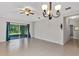 Bright living room with sliding glass doors leading to the outdoors and tiled floors at 2426 Addison Creek Dr, Kissimmee, FL 34758