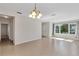 Bright, open living room featuring large windows, tile floors, and neutral decor at 2426 Addison Creek Dr, Kissimmee, FL 34758
