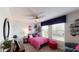 Bright bedroom with large windows, a ceiling fan and stylish decor at 2441 Spring Tune Aly, Kissimmee, FL 34744