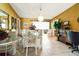 Elegant dining room with a chandelier, seating for eight, and access to the living area at 2504 Caribbean Ct, Orlando, FL 32805