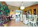 Formal dining room with elegant wallpaper, a modern chandelier, and seating for six at 2504 Caribbean Ct, Orlando, FL 32805