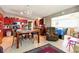 Open kitchen featuring stainless steel appliances, red cabinets, and an island with countertop seating at 2504 Caribbean Ct, Orlando, FL 32805