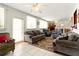 Bright living room featuring neutral paint, tile floors, and a comfortable seating area at 2504 Caribbean Ct, Orlando, FL 32805