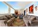 Cozy living room with fireplace, ceiling fan, and lots of seating and decor at 2504 Caribbean Ct, Orlando, FL 32805