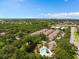 Aerial view of a community with a pool, surrounded by lush greenery and nearby amenities at 2952 Lucayan Harbour Cir # 105, Kissimmee, FL 34746